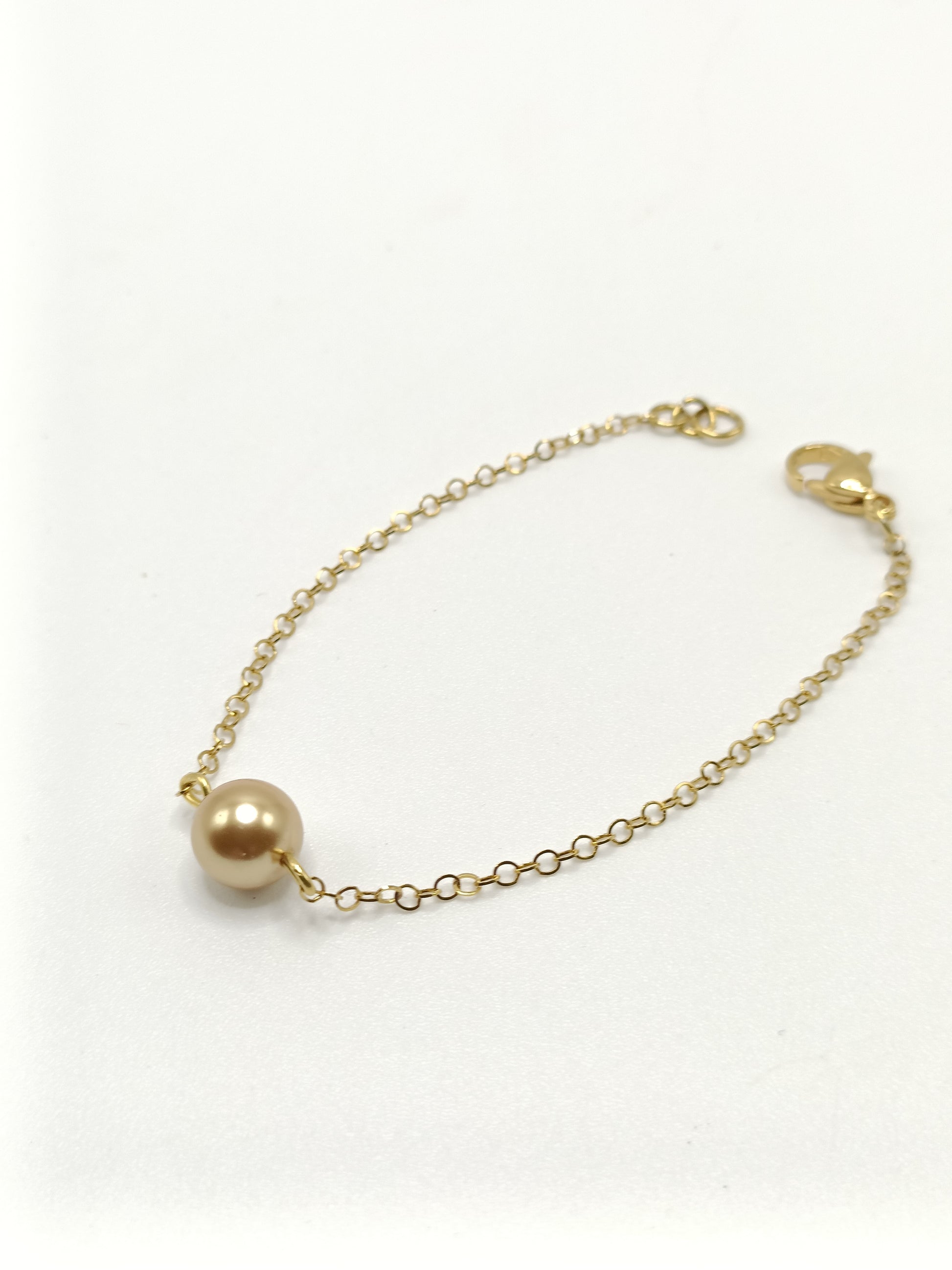 Bracelet fin doré et perle dorée, acier inoxydable